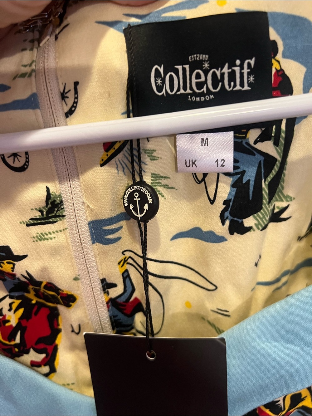 Collectif Cream Dress with Blue Trim and Multicolor Wild West Print